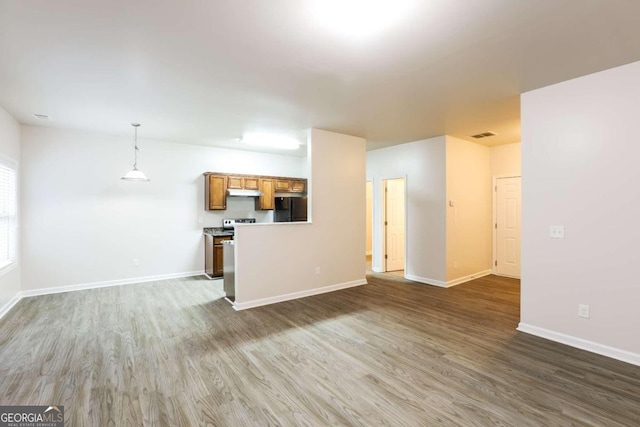 unfurnished living room with dark hardwood / wood-style flooring