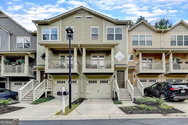 multi unit property featuring a balcony and a garage