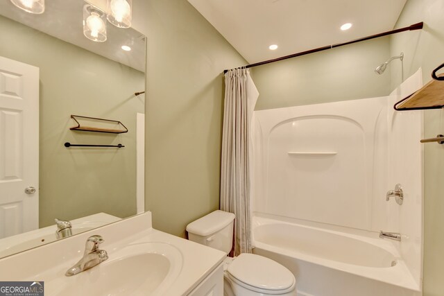 full bathroom with shower / bath combination with curtain, vanity, and toilet