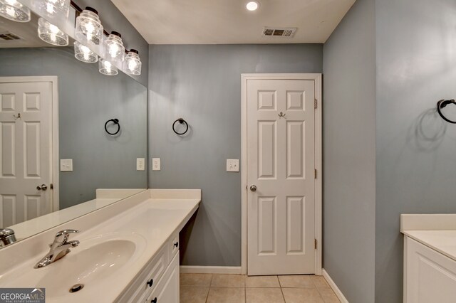 bathroom with vanity and tile patterned floors