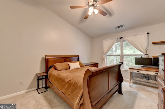 carpeted bedroom featuring ceiling fan and vaulted ceiling