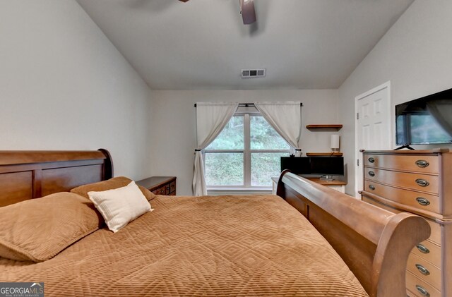 bedroom with vaulted ceiling and ceiling fan