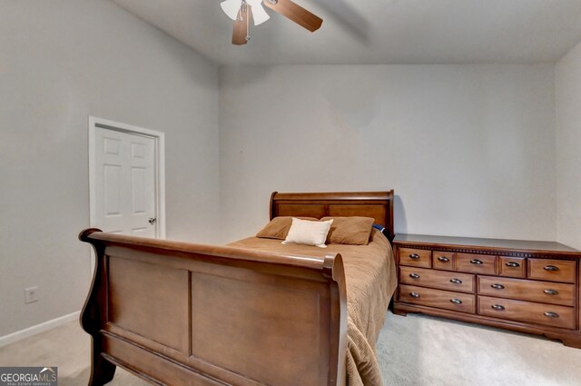 bedroom with ceiling fan and light colored carpet