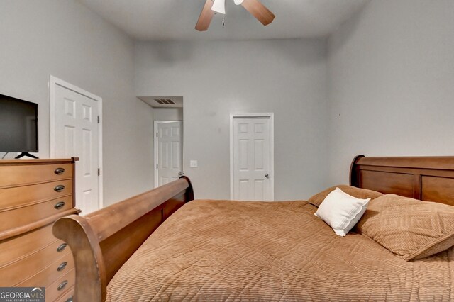 bedroom featuring a high ceiling and ceiling fan