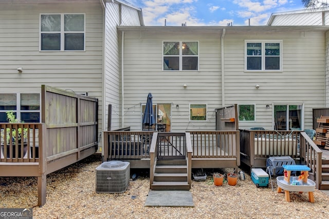 back of house featuring a deck