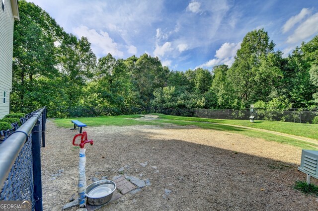 view of property's community with a lawn