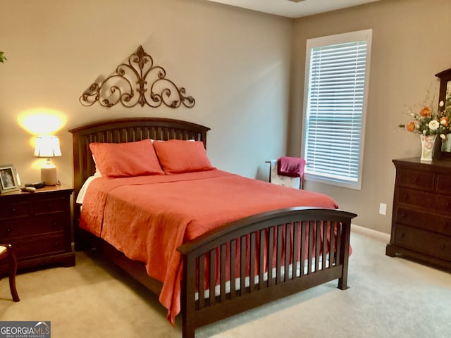 bedroom with light carpet