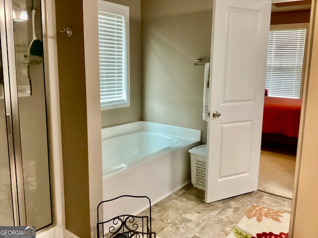 bathroom with independent shower and bath