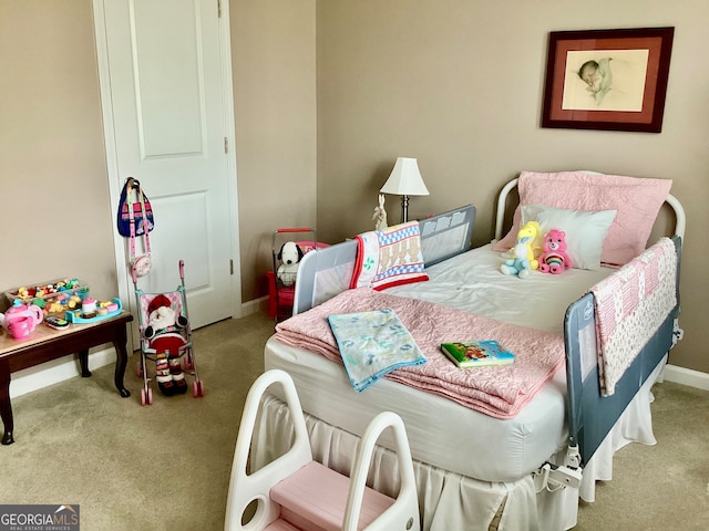 bedroom featuring light colored carpet