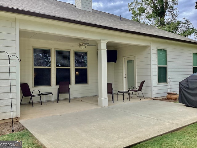 back of house with ceiling fan and a patio area