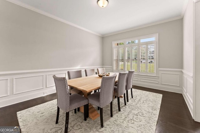 dining area with ornamental molding and dark wood-type flooring