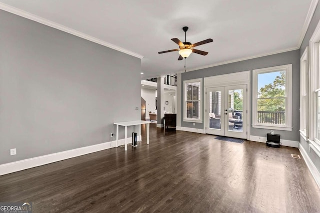 unfurnished living room featuring ceiling fan, french doors, dark hardwood / wood-style floors, and ornamental molding