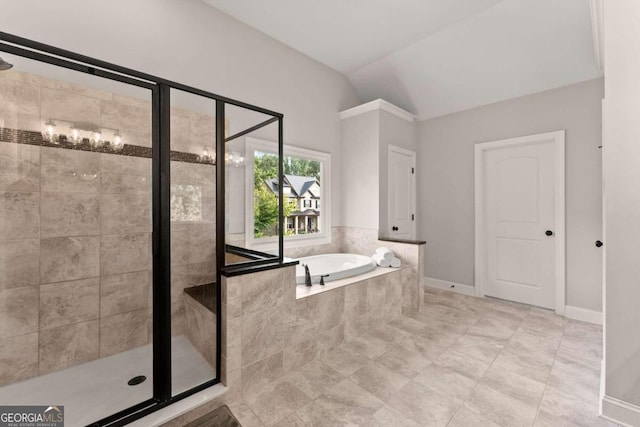 bathroom featuring tile patterned floors, separate shower and tub, and lofted ceiling