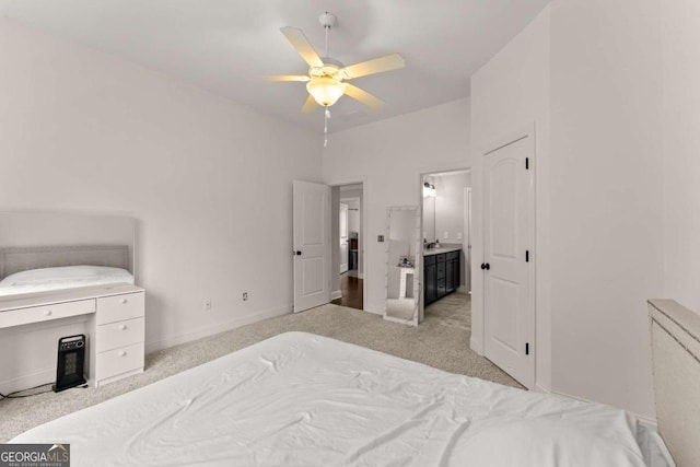 carpeted bedroom featuring ceiling fan and connected bathroom