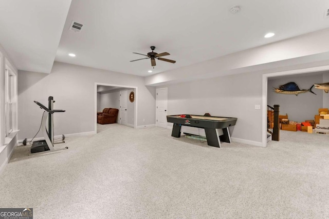 game room with light colored carpet and ceiling fan