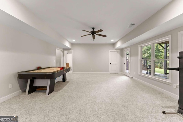 game room with light colored carpet and ceiling fan