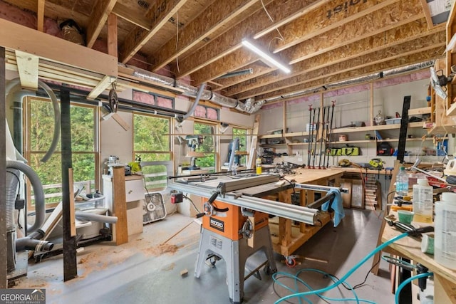 misc room featuring a workshop area and concrete flooring