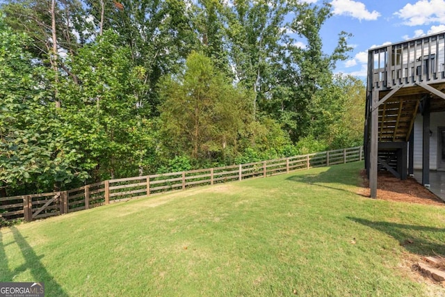 view of yard featuring a wooden deck