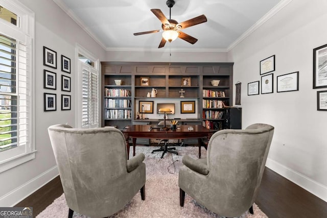 home office with dark hardwood / wood-style floors, ceiling fan, and ornamental molding