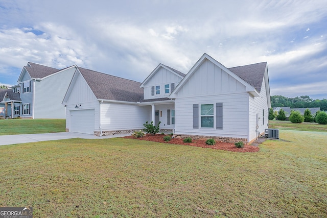 view of front of property featuring cooling unit, a front lawn, and a garage