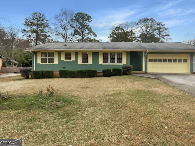 ranch-style home featuring a garage and a front yard