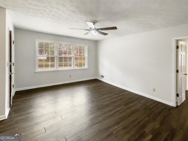 washroom with hookup for a washing machine, dark hardwood / wood-style floors, electric dryer hookup, and cabinets