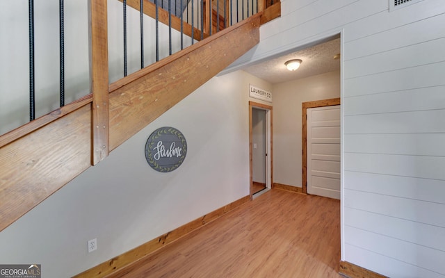 interior space featuring hardwood / wood-style floors and a textured ceiling