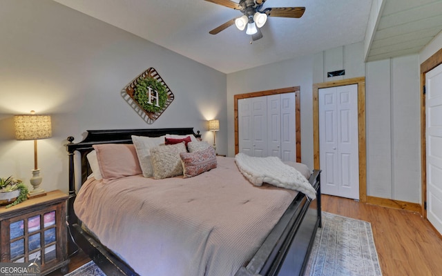 bedroom with light hardwood / wood-style flooring and ceiling fan