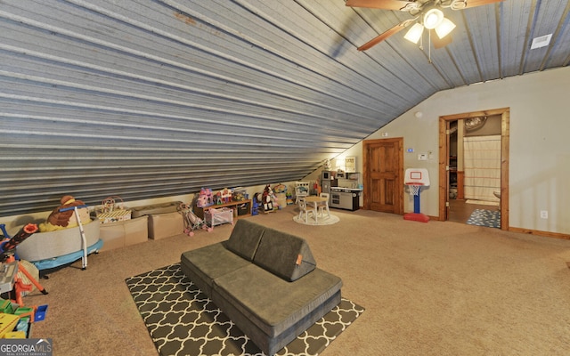 game room with carpet flooring, ceiling fan, and vaulted ceiling