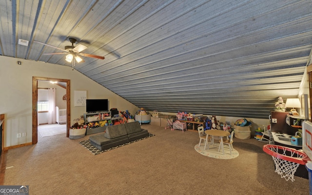 recreation room featuring ceiling fan, carpet floors, and lofted ceiling