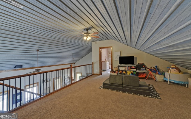 playroom featuring carpet flooring, vaulted ceiling, and ceiling fan