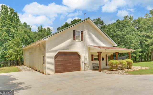 view of front facade with covered porch and a garage