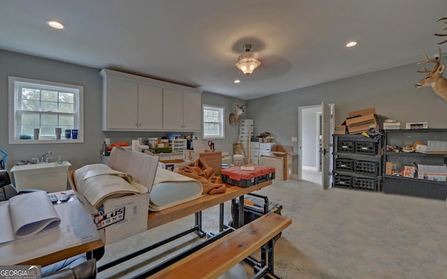 interior space featuring carpet flooring and ceiling fan