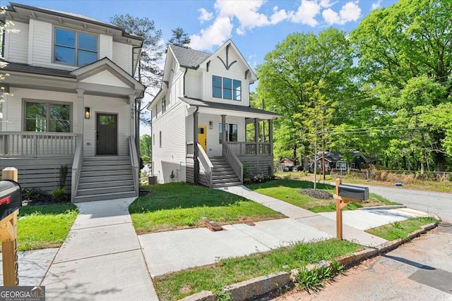 view of front of property featuring a front lawn and covered porch