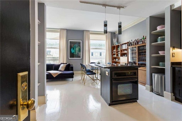 bar featuring black oven, light hardwood / wood-style flooring, plenty of natural light, and ornamental molding