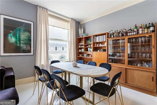 dining area with crown molding