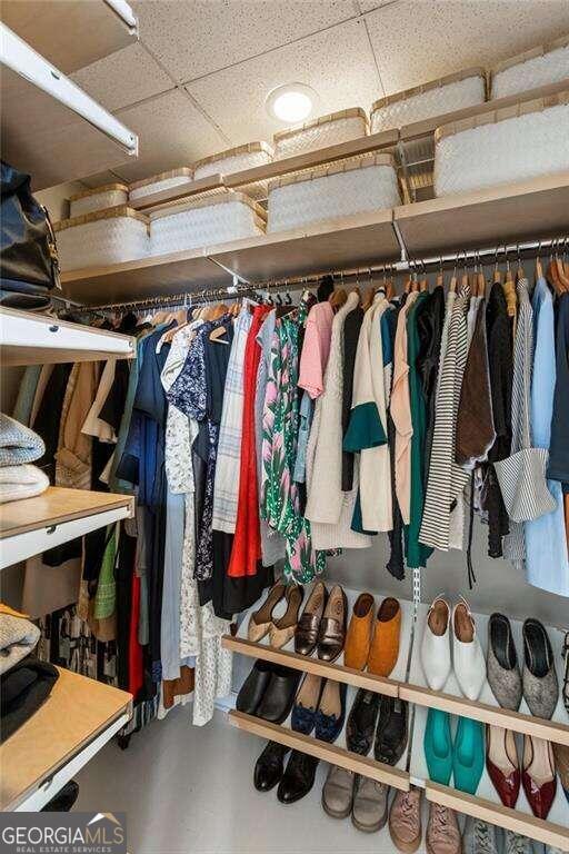 spacious closet with a drop ceiling