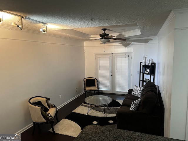 living room featuring french doors, hardwood / wood-style floors, and a textured ceiling