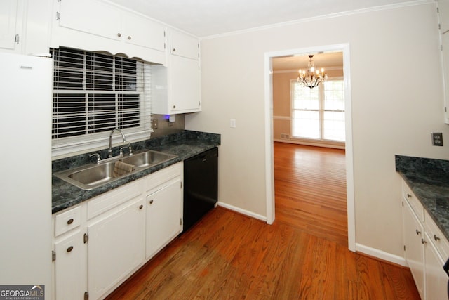 kitchen with white refrigerator, ornamental molding, white cabinetry, hardwood / wood-style flooring, and black dishwasher