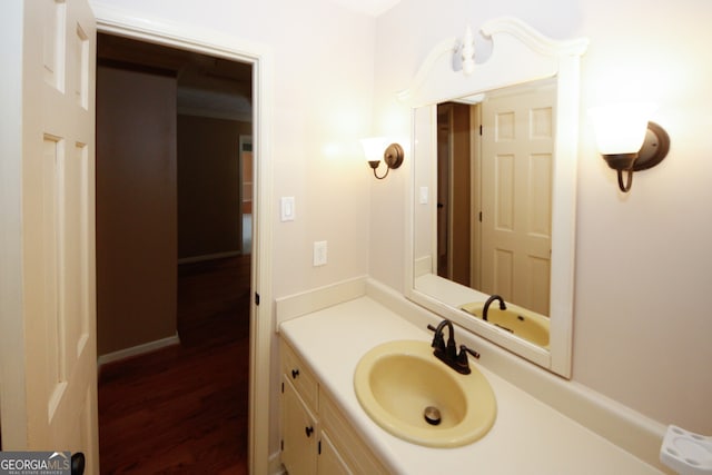 bathroom featuring wood-type flooring and vanity