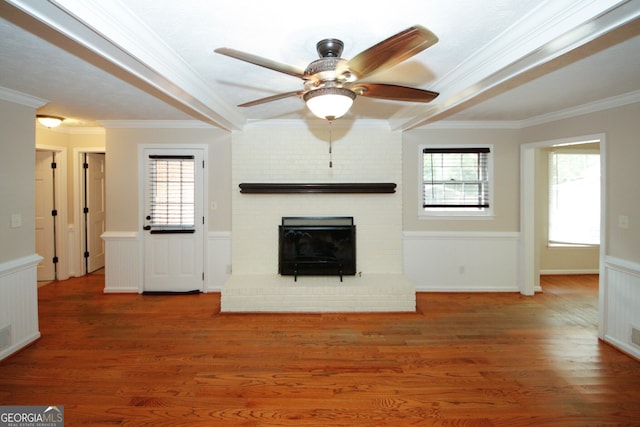 unfurnished living room featuring a fireplace, plenty of natural light, and dark hardwood / wood-style floors