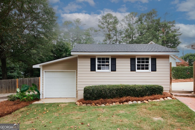 garage featuring a yard