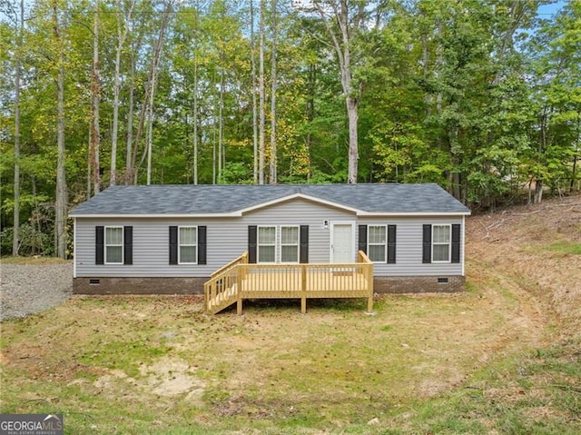 view of front of property with a front lawn and a deck