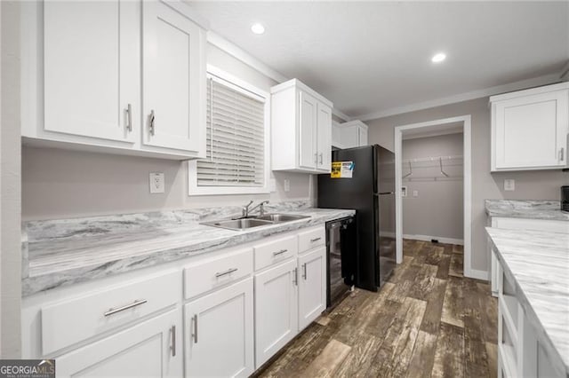 kitchen featuring dark hardwood / wood-style floors, black dishwasher, white cabinetry, and sink