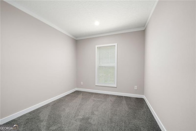 carpeted spare room with a textured ceiling and ornamental molding