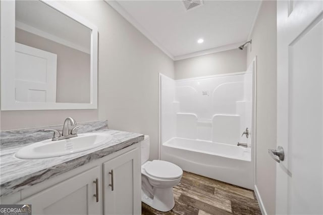 full bathroom featuring vanity, hardwood / wood-style flooring, bathing tub / shower combination, and toilet