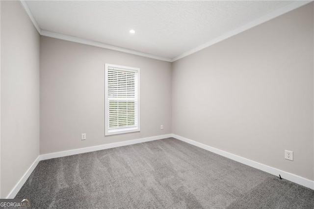 carpeted spare room featuring ornamental molding