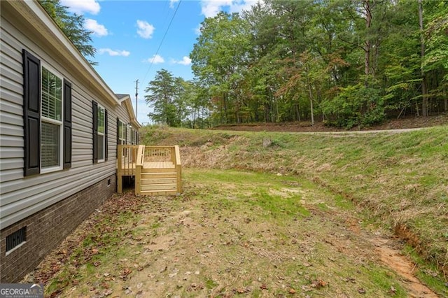 view of yard with a deck