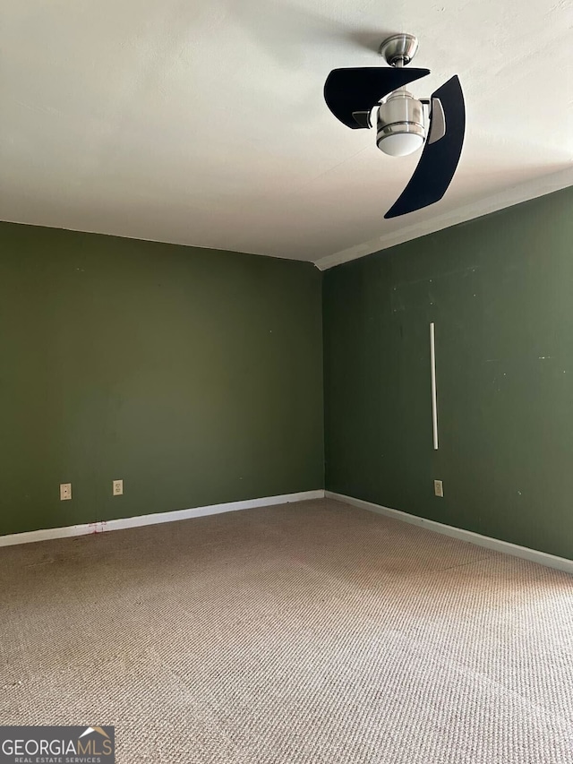 carpeted empty room with ceiling fan