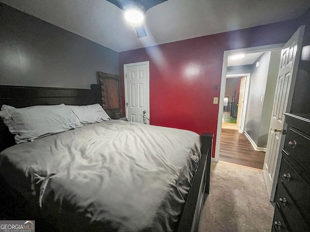 carpeted bedroom with ceiling fan